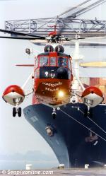 ID 464 JERVIS BAY (1992/50235grt/IMO 9005534, ex-JERVIS STAR. Renamed KAYAM for voyage to the Indian breakers in 2014) discharging at Southampton, England as a UK Coastguard helicopter lands after...